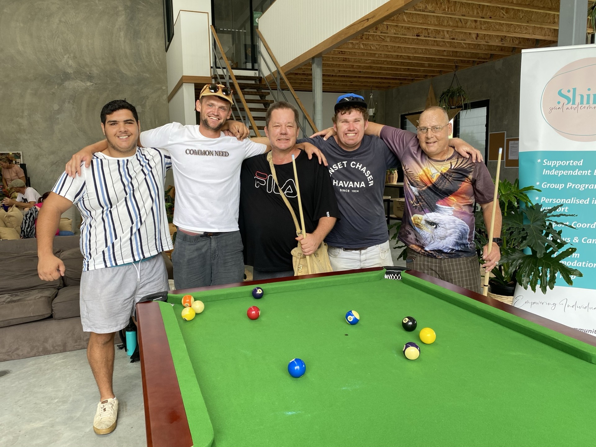 participants playing pool together at their SIL home